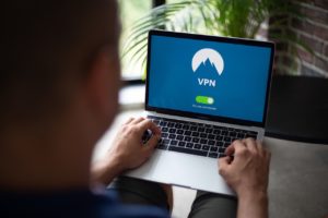 a person setting up NordVPN on Apple TV through his laptop 